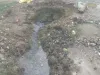 गामडा ब्राह्मनिया में जलदाय विभाग की लापरवाही से बस स्टेंड मुख्य सड़क खड्डों में तब्दील, युवाओ ने सड़क के खड्डों को रेत गिट्टी से भरा